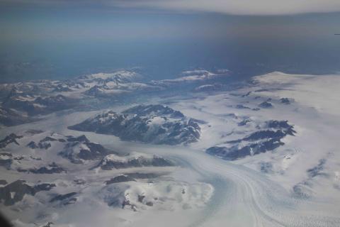 Coastal glaciers in SE Greenland, taken from 28,000' 