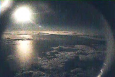 AV-6 nose camera view of moon over TS Nadine from 63,000 ft (9.27.12)
