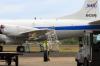 NASA P-3B crewman moves apre equipment into STP hangar.